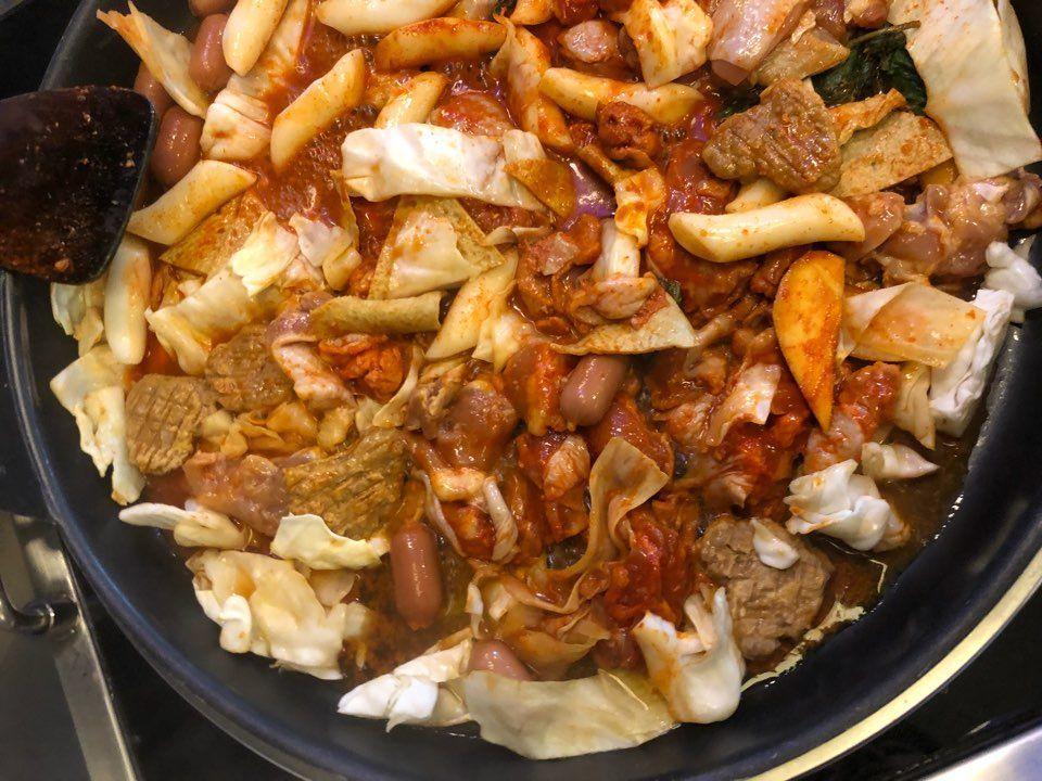 An inviting restaurant exterior with a traditional Korean vibe and signage, offering a glimpse into its cultural ambiance and dining experience.